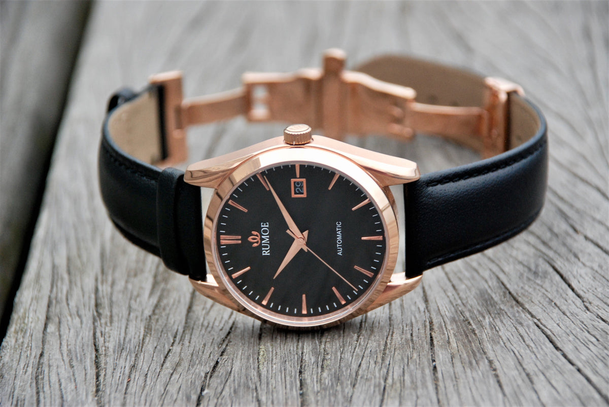 Dalum Black / Rose Gold with its butterfly clasp open