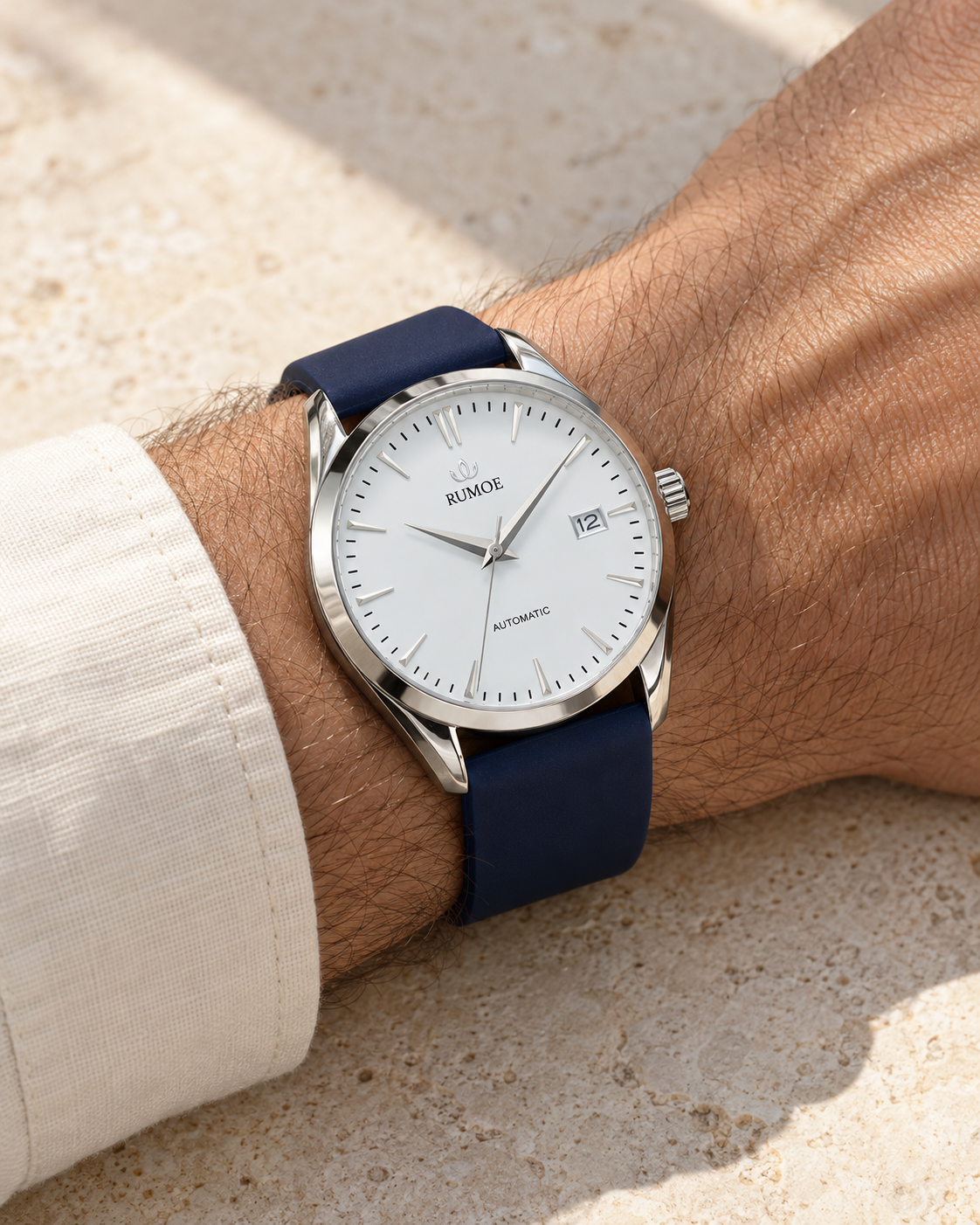 Nobel Royal Rimbo with a white dial, silver case and navy rubber strap worn on the wrist